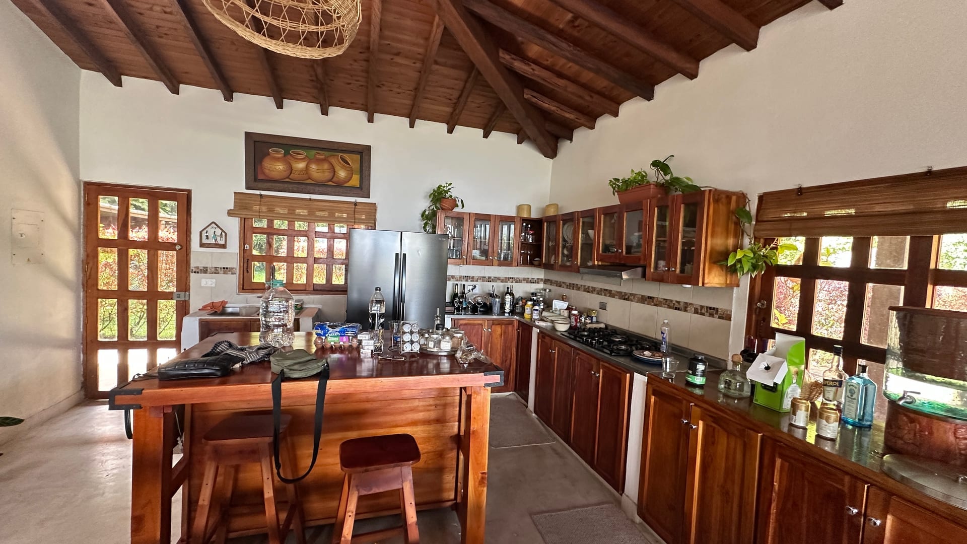 Rustic kitchen with vaulted wood ceiling and island