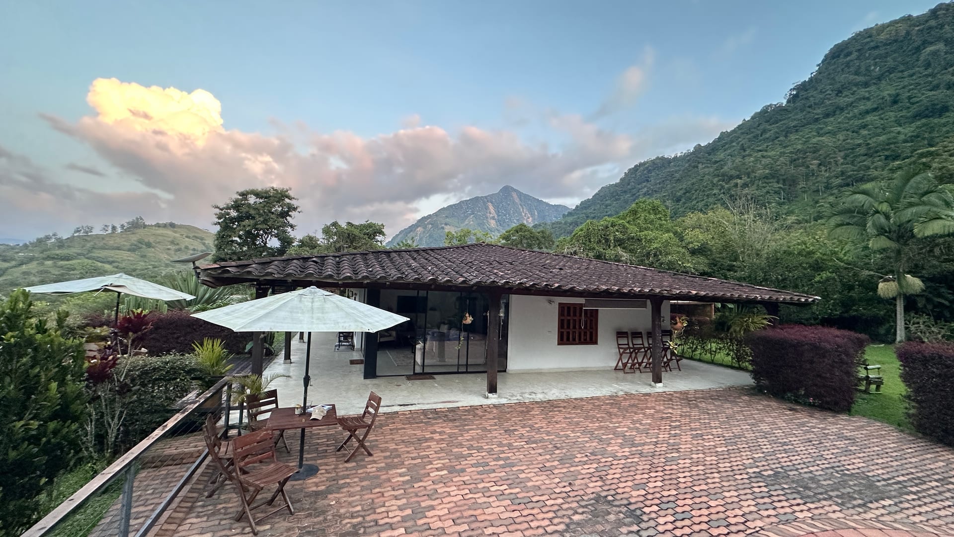 Estate terrace at sunset with Cerro Tusa and Andean peaks